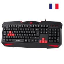 Black gaming keyboard with red accents on a white background, featuring a French flag icon.