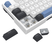 Close-up of a mechanical keyboard with keycaps removed, revealing the internal components.
