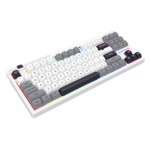 Mechanical keyboard with white frame and gray and black keys on a white background