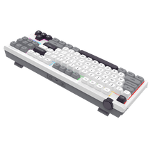 Mechanical keyboard with white and gray keys on a black background