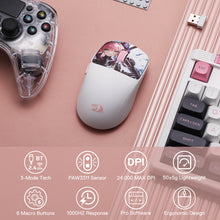 White gaming mouse with floral design on a pink surface with gaming accessories.